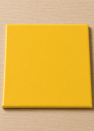 Gele_glanzende_keramische_tegel_15x15_cm